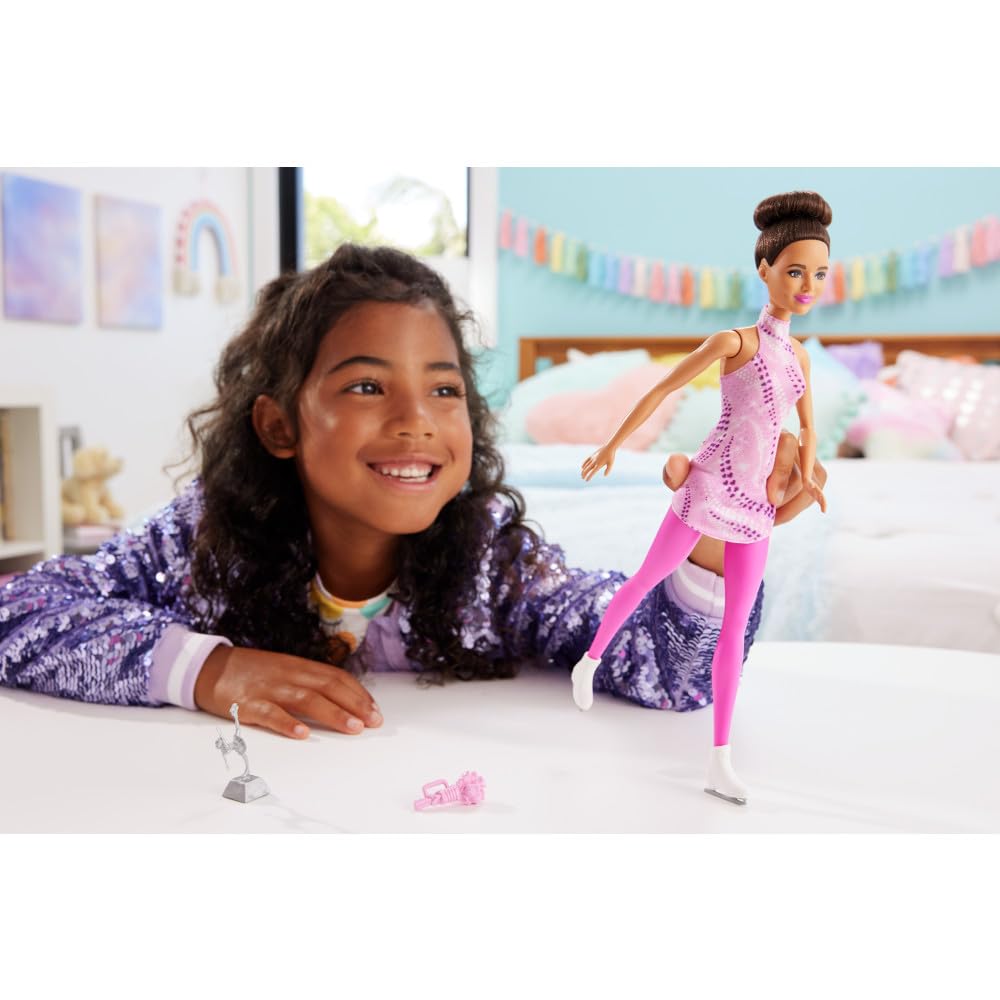 Barbie Careers Fashion Doll & Accessories, Brunette in Removable Pink Skate Outfit with Ice Skates & Trophy
